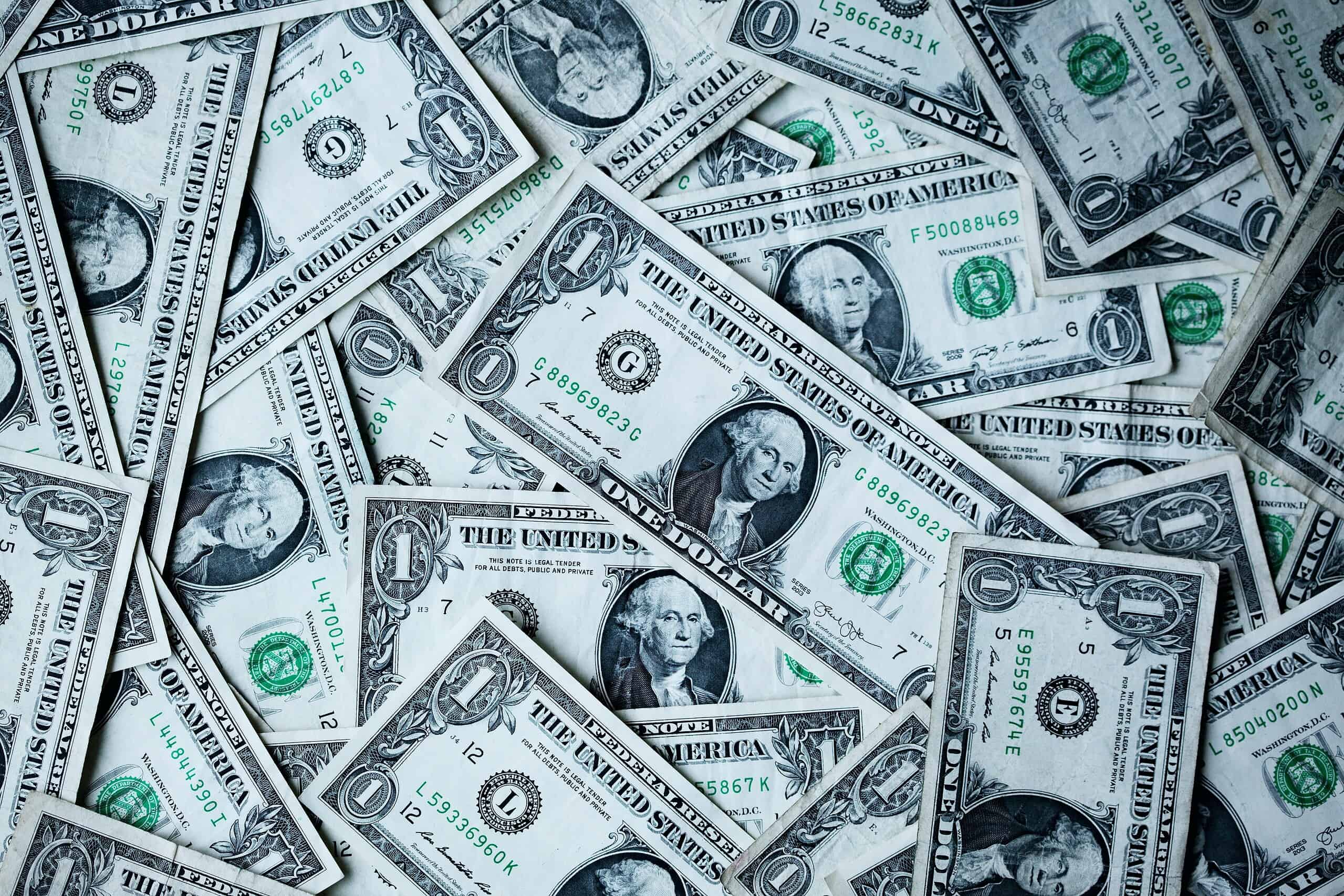 several US dollar bills layed out
