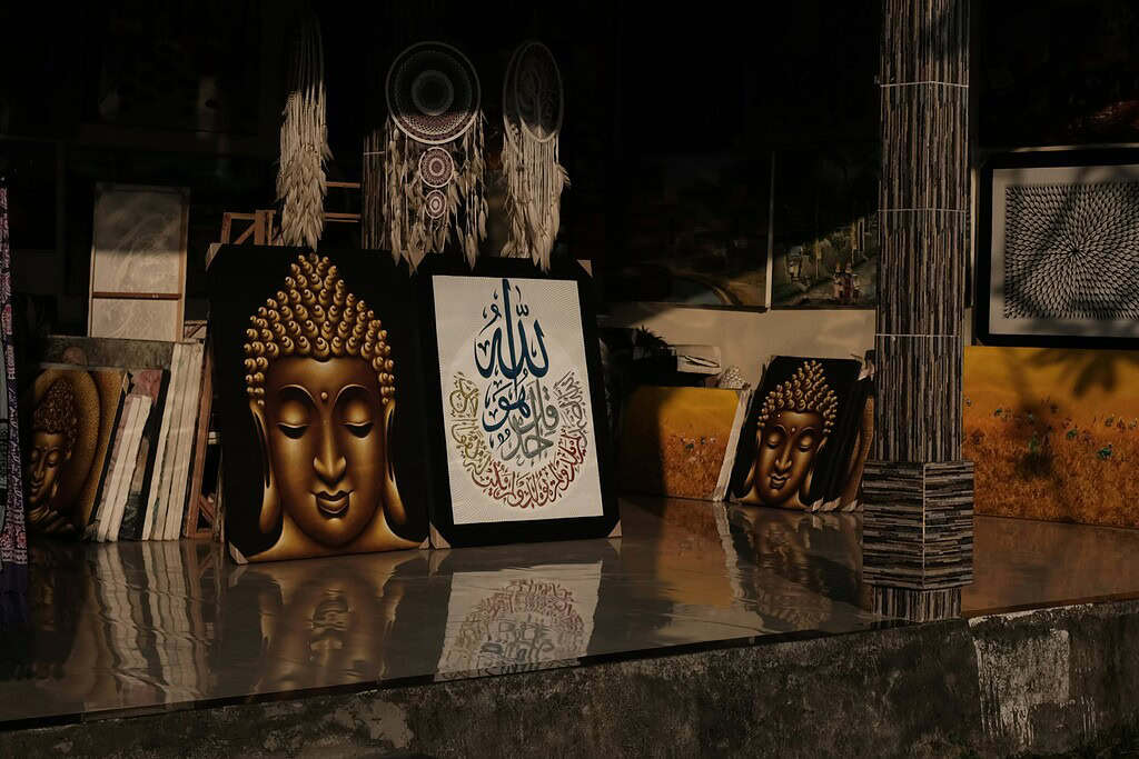 a few paintings displayed at a shop in Bali