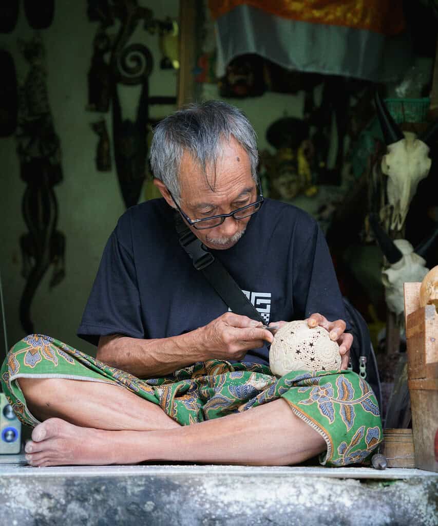 a man carving pottery in Bali