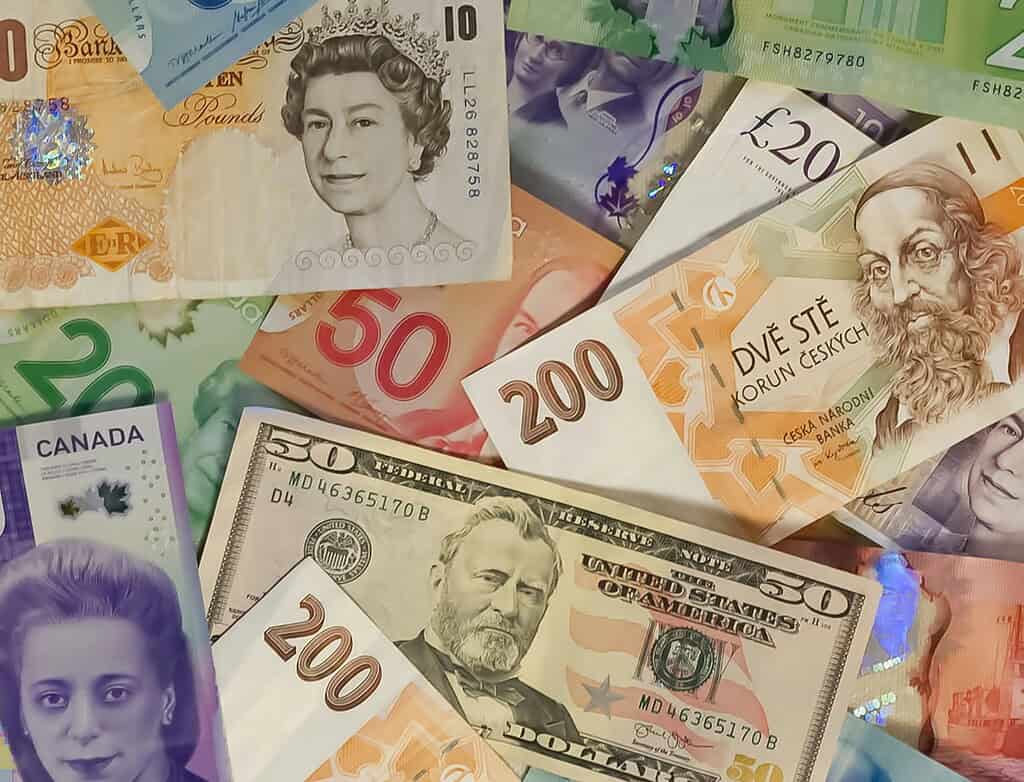 multiple currency notes from different countries photographed 
