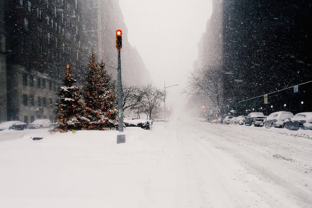 A snow covered street in NYC in the midst of Winter 