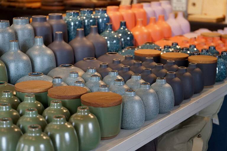 several Japanese ceramics displayed in a shop