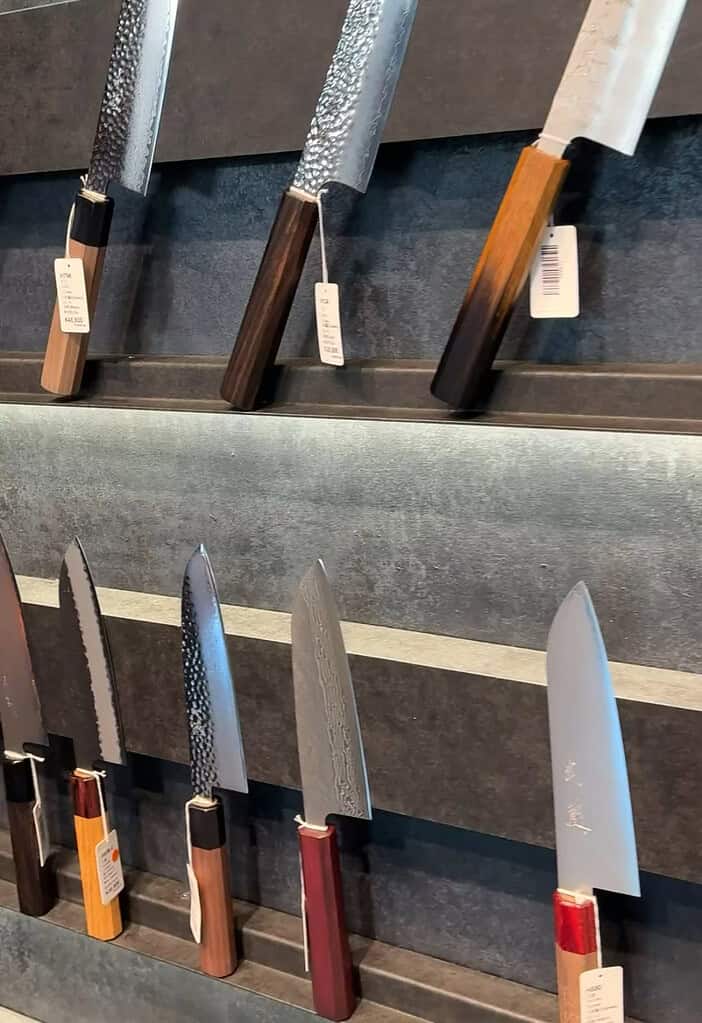 various expensive Japanese knives displayed at a shop in Kyoto