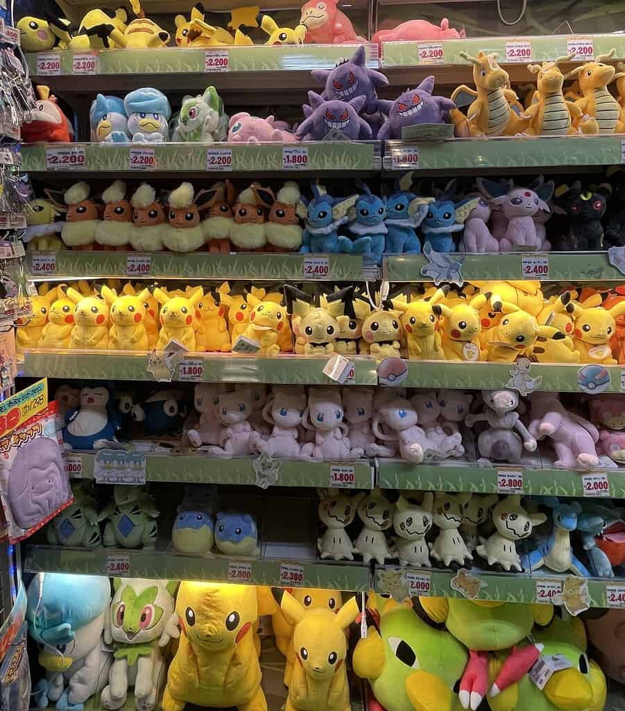 several fliffy pokemon plushies displayed at don quijote